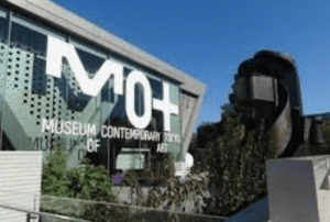 Exterior of the Museum of Contemporary Art Tokyo with a large sign and modern architectural design