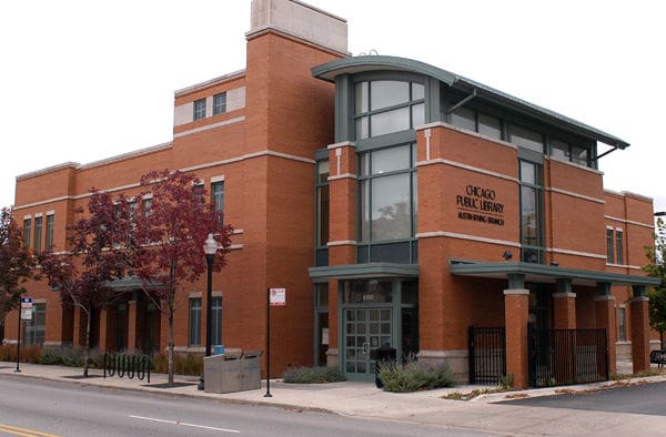Chicago Public Library branch with brick exterior, large windows, and a curved roof entrance.