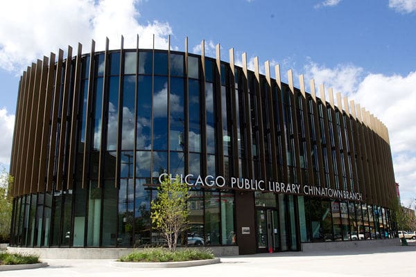 Chicago Public Library Chinatown Branch, modern cylindrical building with glass windows and metal accents