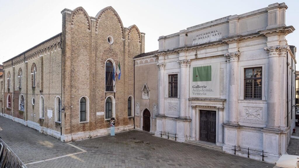 Exterior of the Gallerie dell'Accademia in Venice, showing two historic adjoining buildings.
