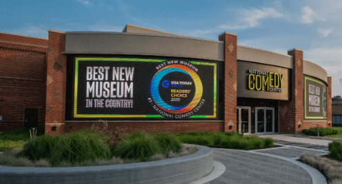 Exterior of the National Comedy Center with award display for USA Today's 2020 Best New Museum.
