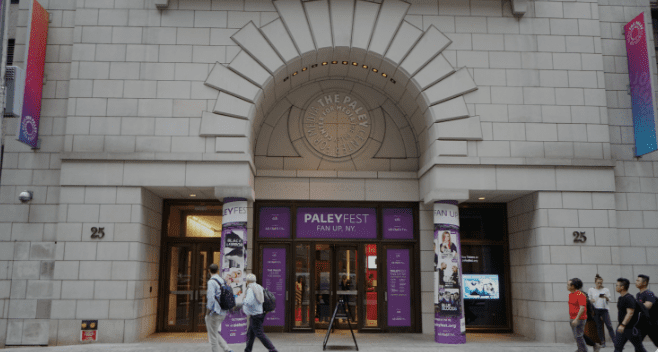 Entrance to PaleyFest Fan Up NY event, light stone building with arched design, columns, posters
