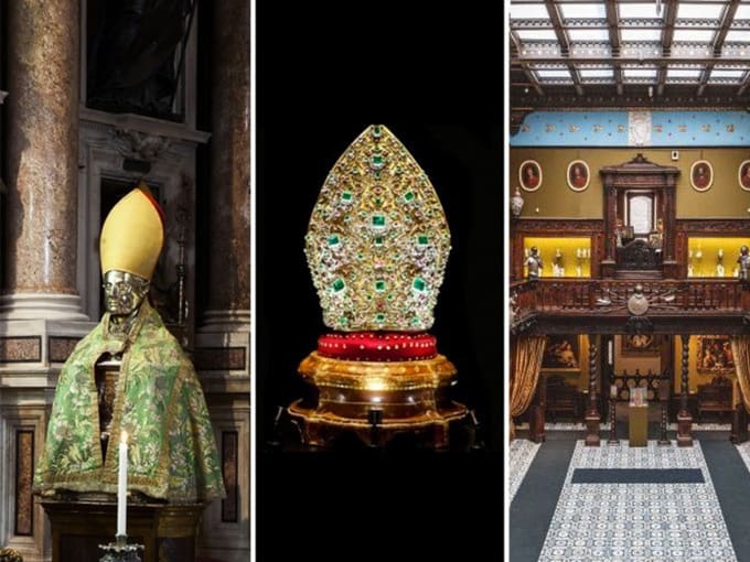 Statue of religious figure, jeweled bishop's mitre, and opulent historic building interior.