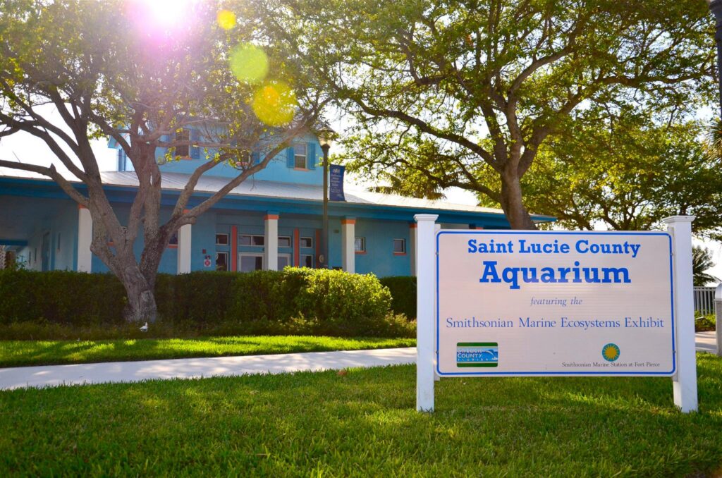 Saint Lucie County Aquarium entrance with Smithsonian Marine Ecosystems Exhibit sign.